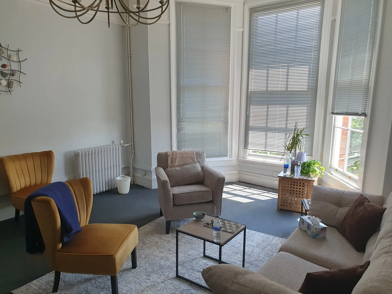 The full room with bay windows letting in soft daylight.